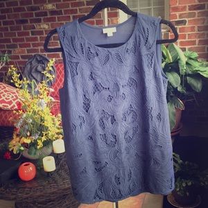 Cotton blend tank with detailed overlay on front.